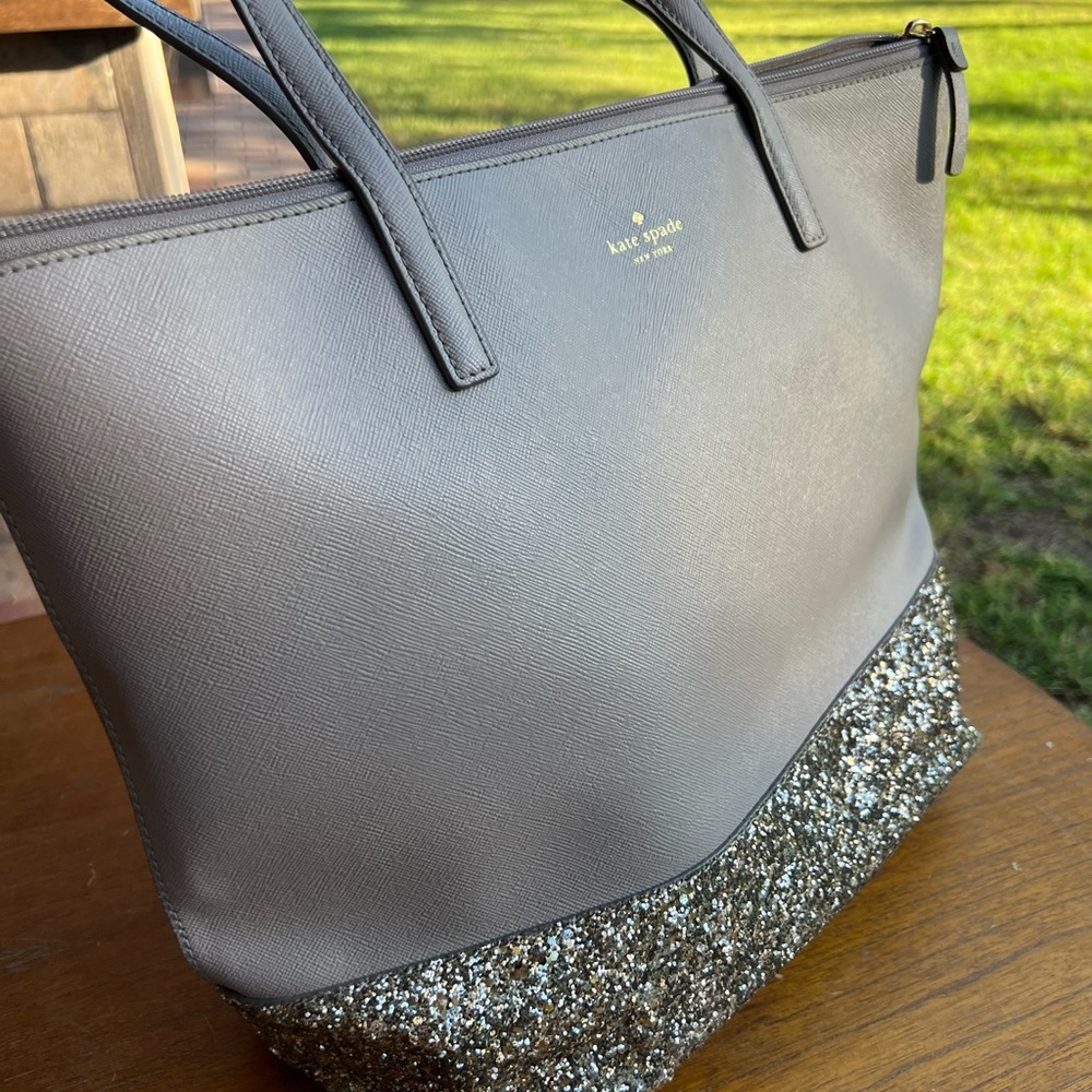Slightly used Kate Spade Greta Court Penny shoulder tote bag in grey & glitter.
